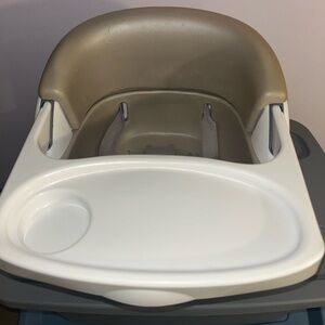 Tan and White Booster Seat